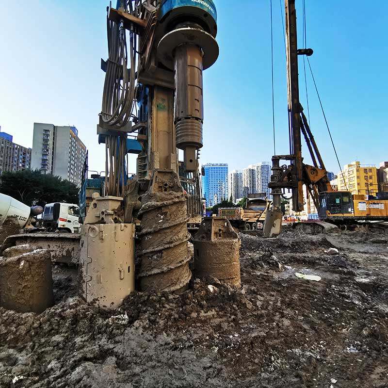 bored pile rig operating in the site with 3 piling tools including a drilling bucket, bullet teeth core barrel and firmtech roller bit core barrel